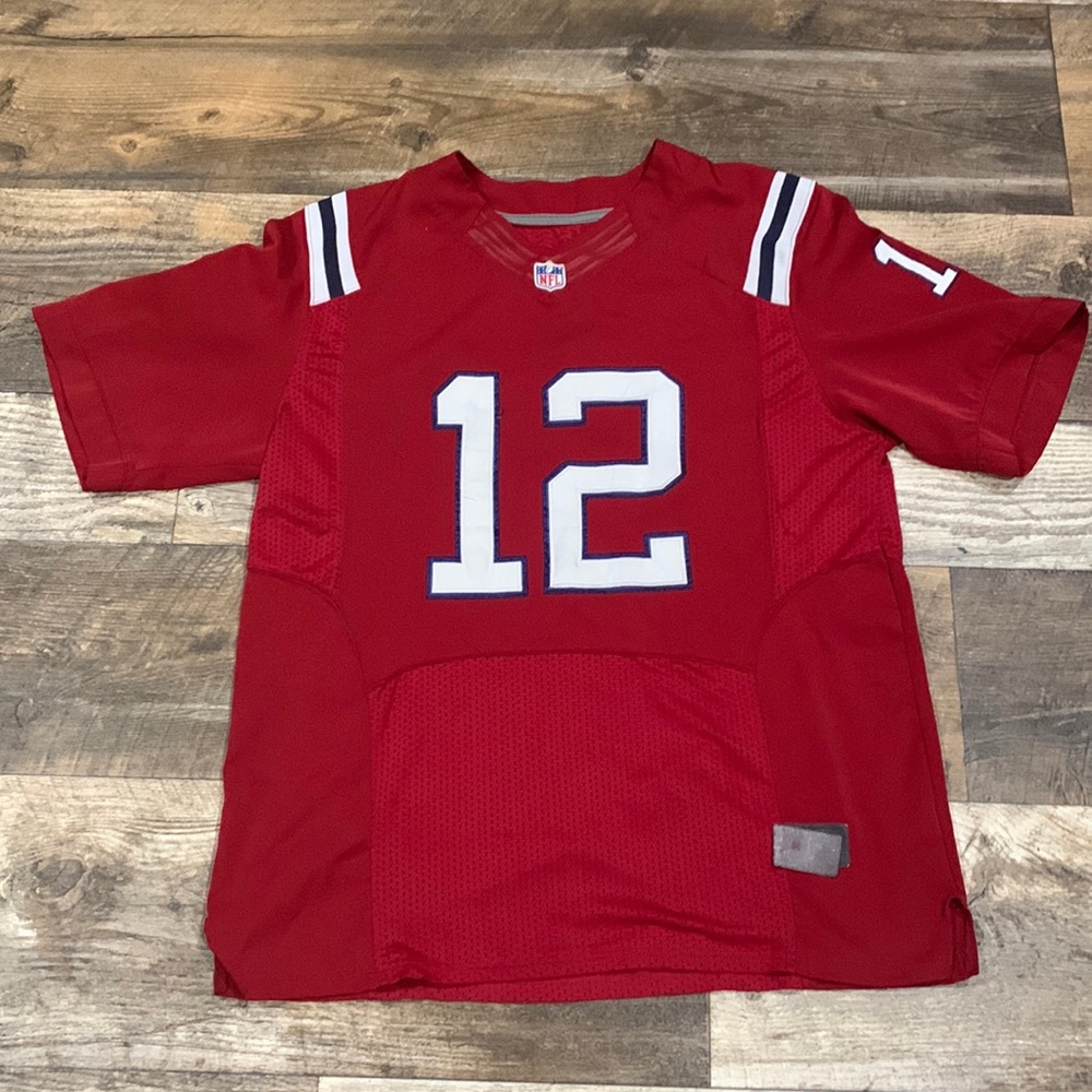 Nike # 12 Tom Brady Jersey no tag on inside and tag is falling off below size 48